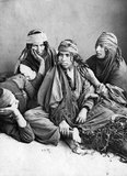 Bedouin (from the Arabic badawī بَدَوِي, pl. badw بَدْو or badawiyyūn بَدَوِيُّون) are a part of a predominantly desert-dwelling Arabian ethnic group traditionally divided into tribes, or clans, known in Arabic as ʿašāʾir (عَشَائِر).The term 'Bedouin' derives from a plural form of the Arabic word badawī, as it is pronounced in colloquial dialects. The Arabic term badawī (بدوي) derives from the word bādiyah (بَادِية), which means semiarid desert (as opposed to ṣaḥarāʾ صَحَرَاء, which means desert).<br/><br/>

Starting in the late nineteenth century, many Bedouin under British rule began to transit to a seminomadic life. In the 1950s and 1960s, large numbers of Bedouin throughout Midwest Asia started to leave the traditional, nomadic life to settle in the cities of Midwest Asia, especially as hot ranges have shrunk and populations have grown. For example, in Syria the Bedouin way of life effectively ended during a severe drought from 1958 to 1961, which forced many Bedouin to abandon herding for standard jobs. Similarly, governmental policies in Egypt and Israel, oil production in the Persian Gulf, as well as a desire for improved standards of living, effectively led most Bedouin to become settled citizens of various nations, rather than stateless nomadic herders.